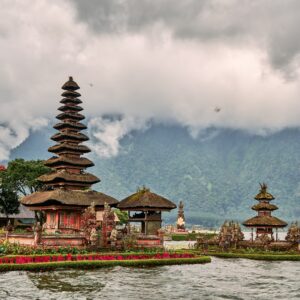 a group of buildings sitting on top of a body of water